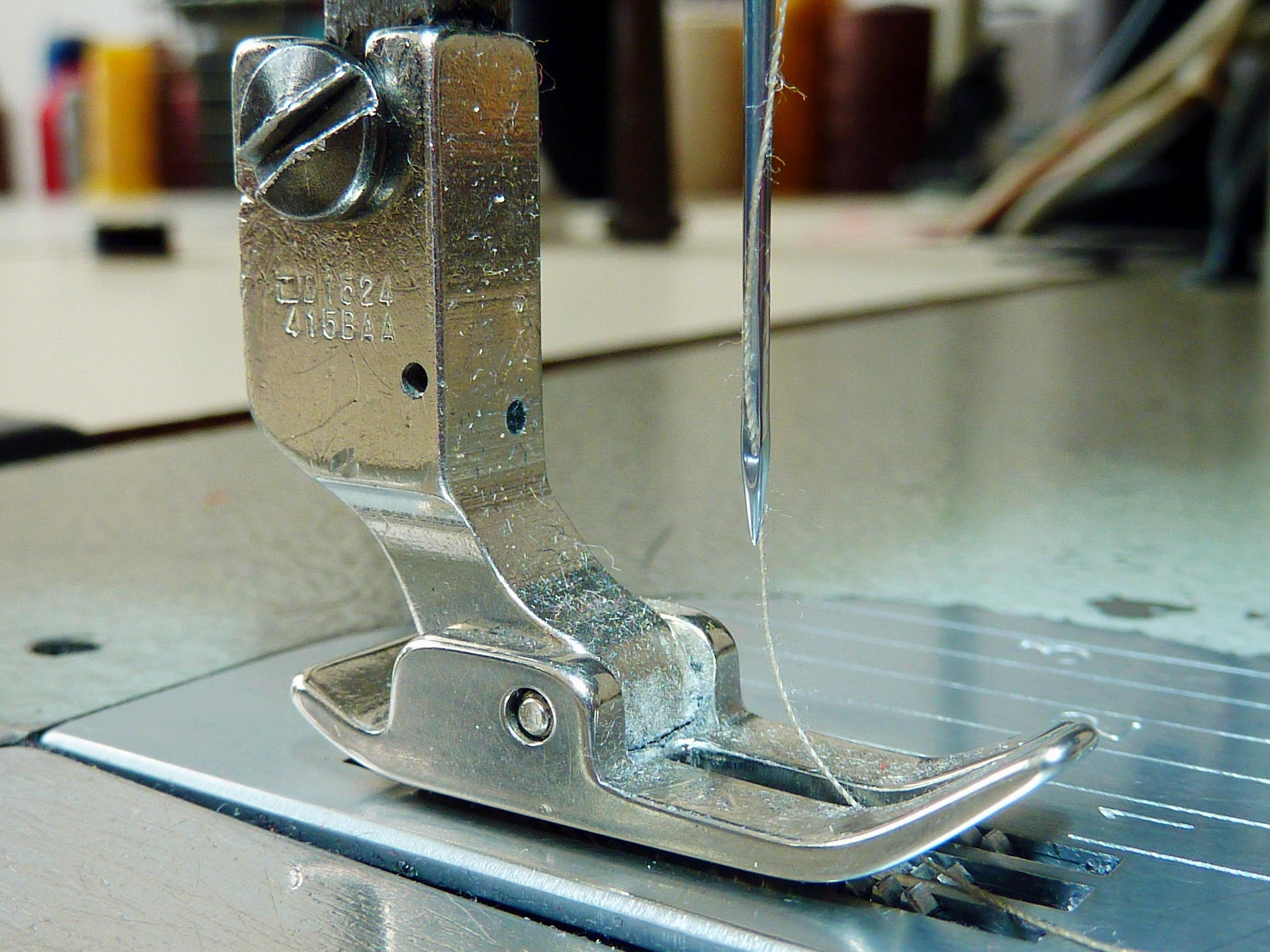 Close-up of sewing machine needle and presser foot